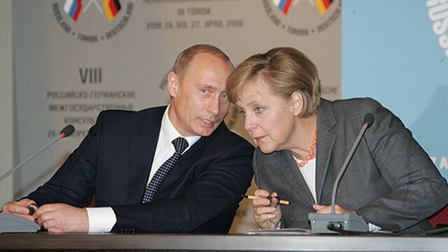 Vladimir Putin with Angela Merkel, both young