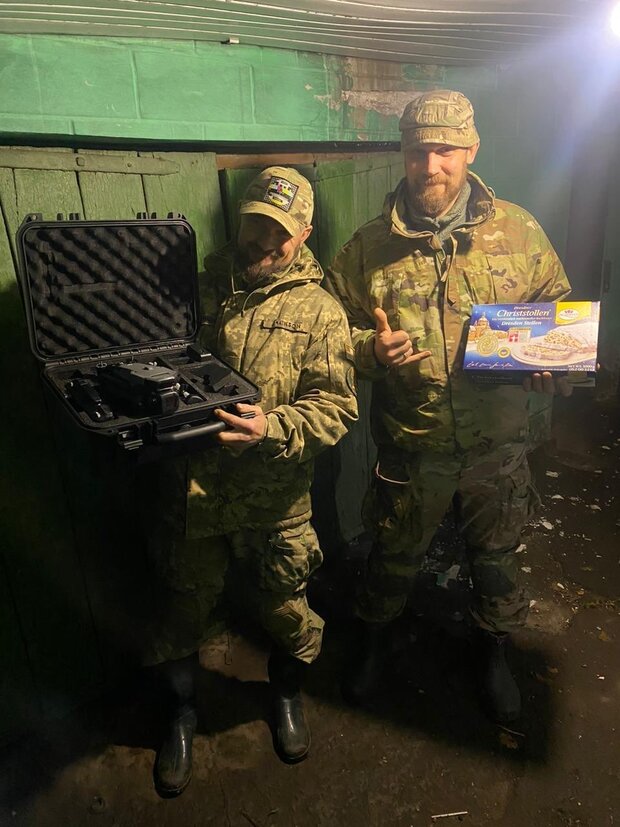 Ukrainian soldiers with a drone and a cake
